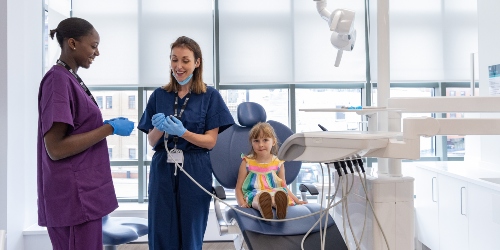 Student and clinician with a patient on the children's clinic